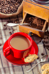 Freshly brewed coffee served with a biscuit for breakfast