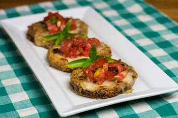 Tray of fresh bruschetta with tomatoes and basil