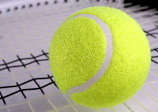 Tennis ball on a racket