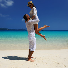 Couple in white on a beach