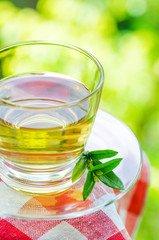 Cup of tea on nature background