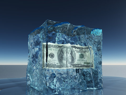 One hundred dollar bill frozen in ice