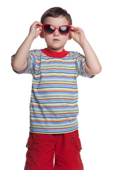 Serious little boy with sunglasses