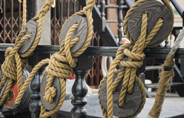 Old wooden blocks on a restored wooden sail ship