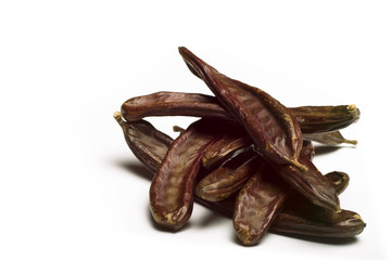 Carob (Ceratonia siliqua) on white