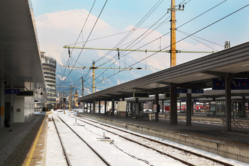 Fototapeta premium Railway station at winter at background of mountains