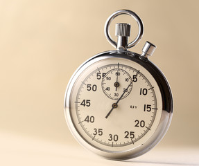 Stopwatch closeup on beige background