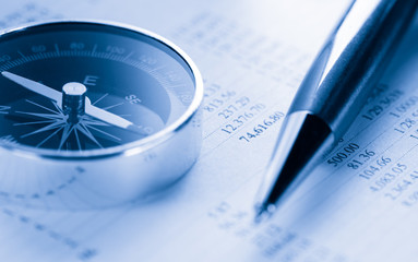 Operating budget, compass and pen