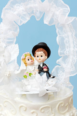 Fototapeta na wymiar Groom and bride cake topper