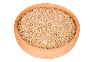Raw brown rice in wooden bowl isolated on white (clipping path)