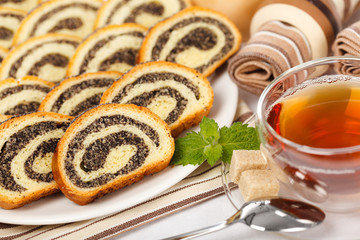 Macro fo poppy seed rolls and tea