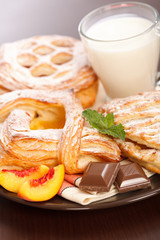 Various cakes and milk breakfast