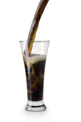 Dark beer being poured into a glass