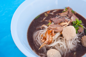 Thai soup with sliced pork and meatballs