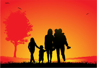 Fototapeta na wymiar happy family and a beautiful sunset