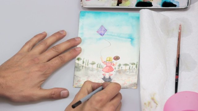 artist working with pastel on an illustration