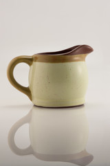 ceramic milk jug on a white