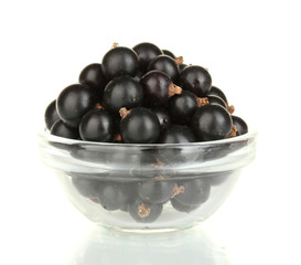 Fresh black currant in transparent bowl isolated on white