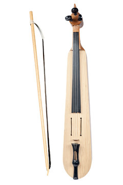 Isolated Turkish fiddle kemence with fiddlestick on white