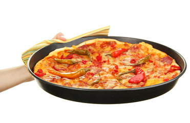 hand holding pepperoni pizza in pan isolated on white