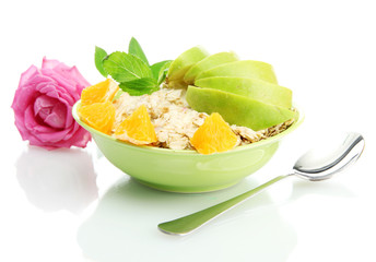 tasty oatmeal with fruits, isolated on white