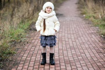 Fototapeta premium Portrait of little girl in autumn outfit