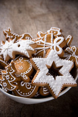 Traditional gingerbread cookies on wooden background