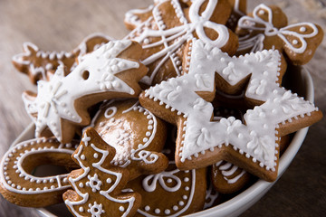 Traditional gingerbread cookies on wooden background