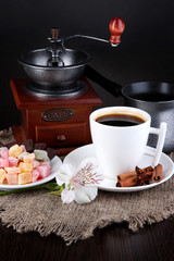 White cup of Turkish coffee with rahat delight, coffee pot and