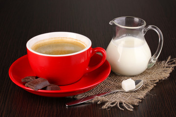 Red cup of Turkish coffee with chocolate and milk