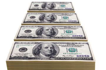stacks of one hundred dollar bills