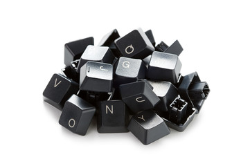 a pile of computer keyboard keys isolated on a white background