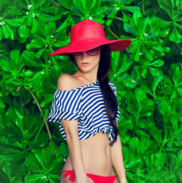 fashion portrait of a girl in the tropics