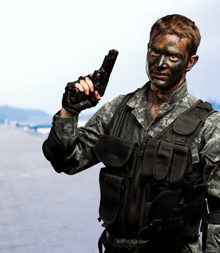 Portrait Of Soldier Holding Gun