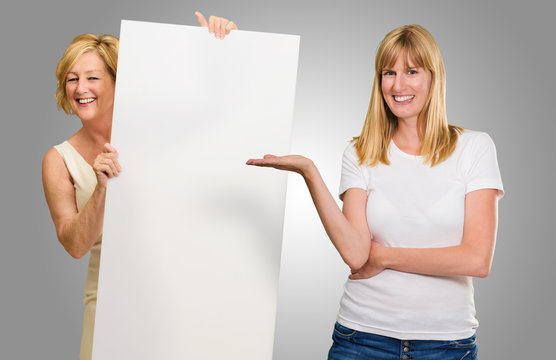 Two Woman Presenting Placard