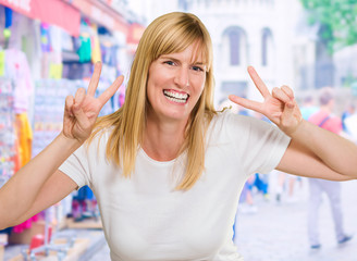 Happy Woman Showing Peace Sign