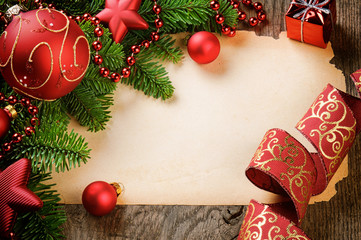 Frame with vintage paper and Christmas decorations