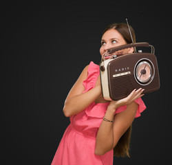 Portrait Of Happy Woman Holding Radio