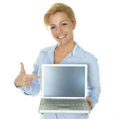 Business woman pointing at her laptop with copyspace