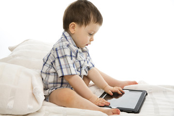 Little boy using electronic tab