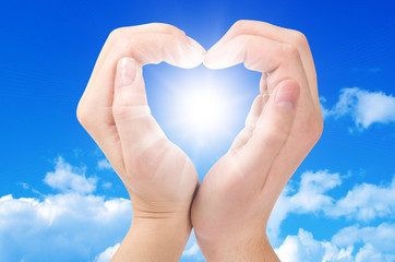 Two hands form a heart shape