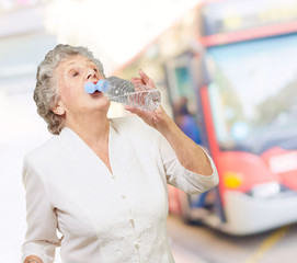 Mature Thirsty Woman Drinking Water