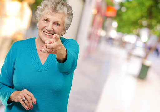 Portrait Of Woman Pointing Her Finger