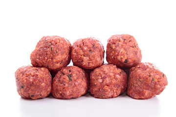 raw meatballs on white background