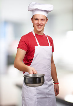 Portrait Of A Chef Holding Pan