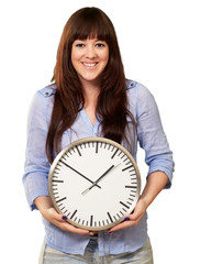 A Young Girl Holding A Clock