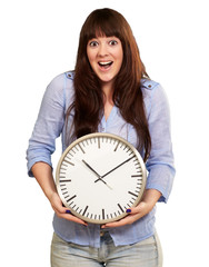 A Young Girl Holding A Clock