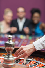 People waiting for roulette wheel