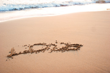Word love on the sand