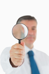 Businessman with magnifying glass